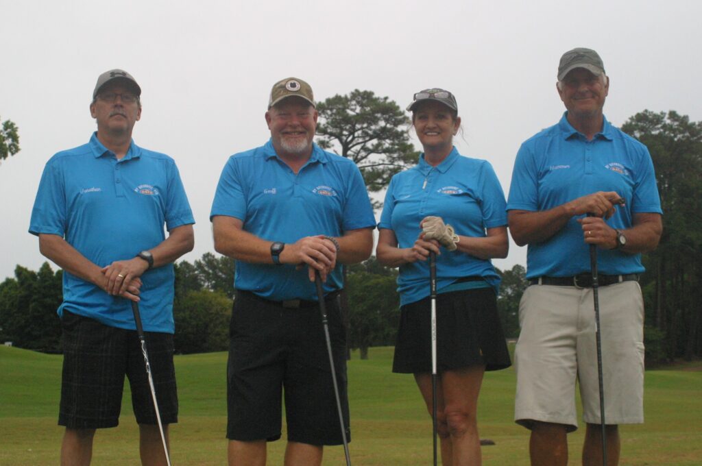 Jonathan, Geoff, Joan and Steve representing My Neighbors' pub as a golf foursome in a charity tournament